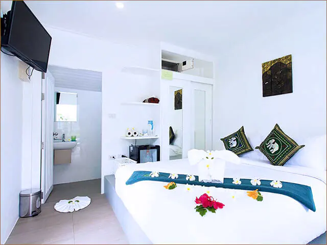 Compact Junior Room at New Leaf Wellness Resort, Koh Samui – single bed, modern décor.